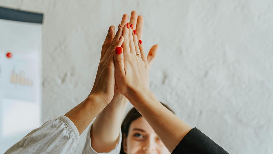 A Group of People Doing a High Five